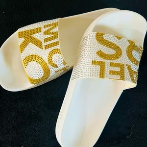 Michael Kors white slides.
